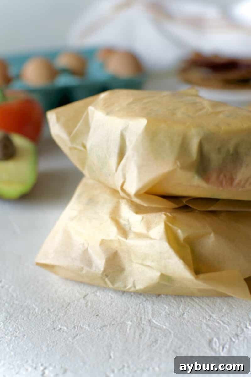 Wholesome Breakfast Sandwich 22 A stack of perfectly wrapped healthy breakfast sandwiches, ready for meal prep.