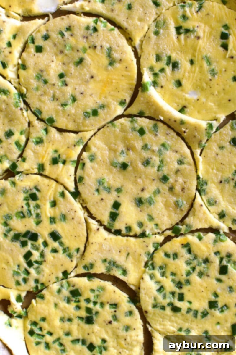 Wholesome Breakfast Sandwich 10 Cutting egg rounds with a biscuit cutter.