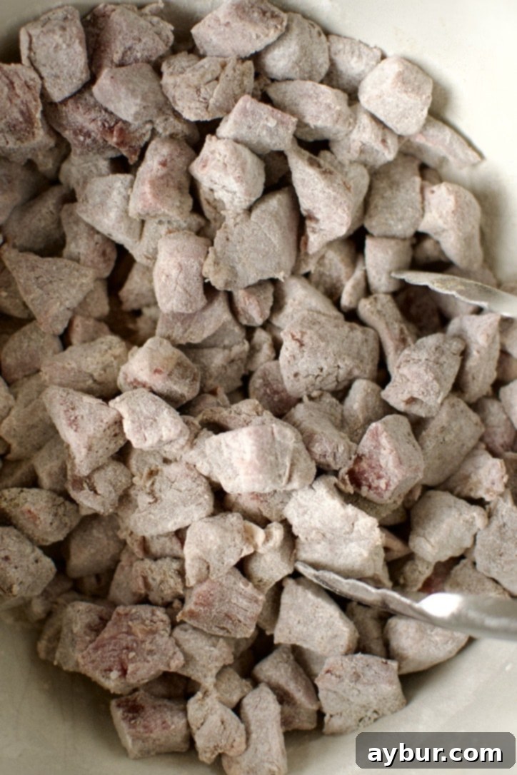 Beef Pot Pie 5 Seasoned stew beef coated lightly with flour, preparing it for searing and creating a rich stew base.