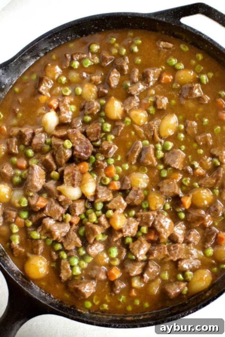 Beef Pot Pie 9 The finished pie filling, rich and tender, simmering gently in the pan, ready to be topped.