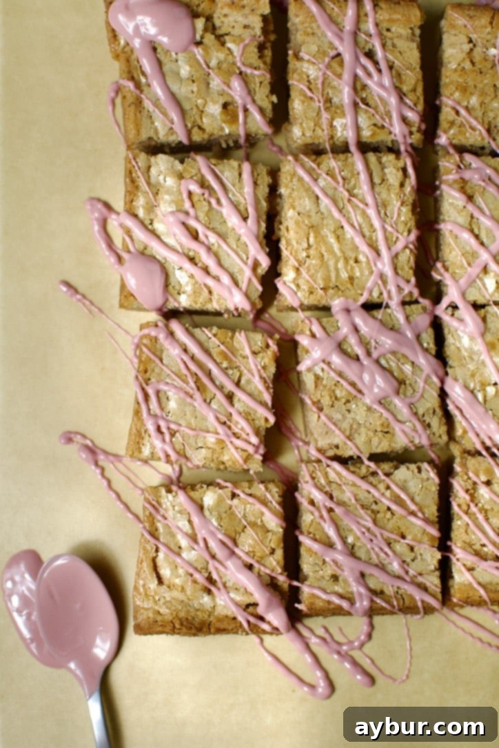 Ruby Chocolate Brownies, beautifully drizzled with extra melted ruby chocolate for an elegant finish.