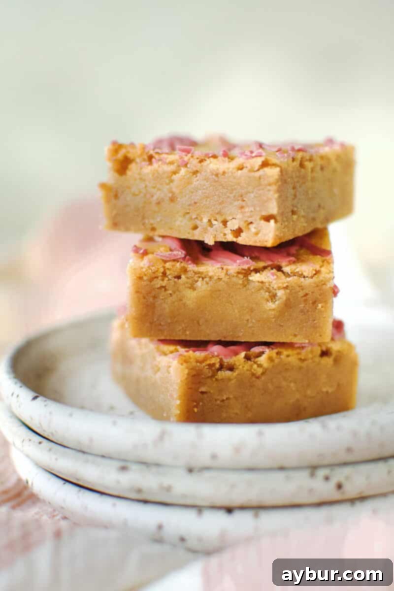 A stack of perfectly cut Ruby Chocolate Brownies, showcasing their rich, fudgy texture.