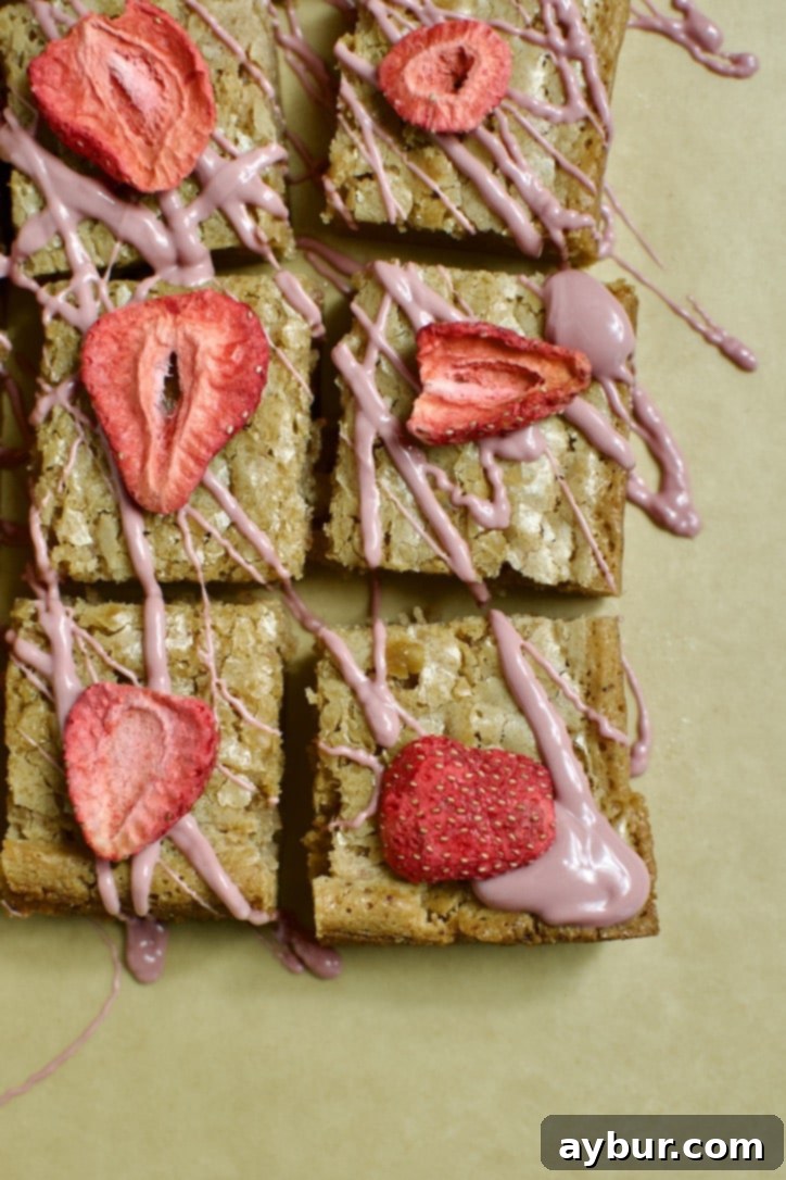 Ruby Chocolate Brownies ready to eat. Each square is topped with a freeze dried strawberry.