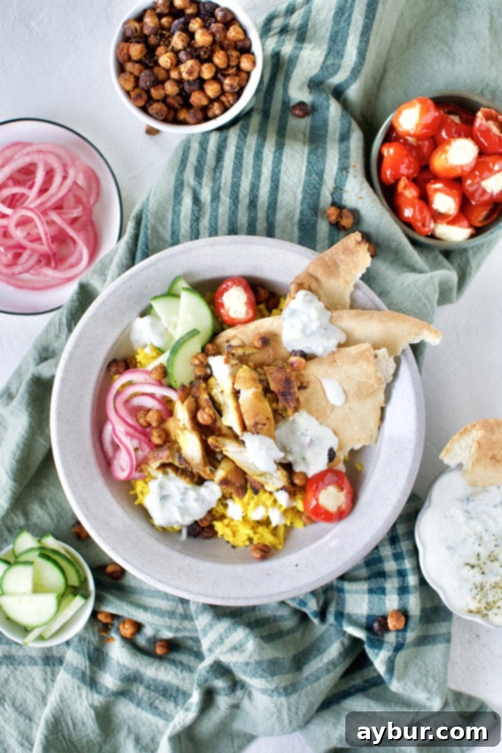 Another view of an appetizing Chicken Shawarma bowl, perfectly plated with tender chicken, rice, and fresh garnishes.