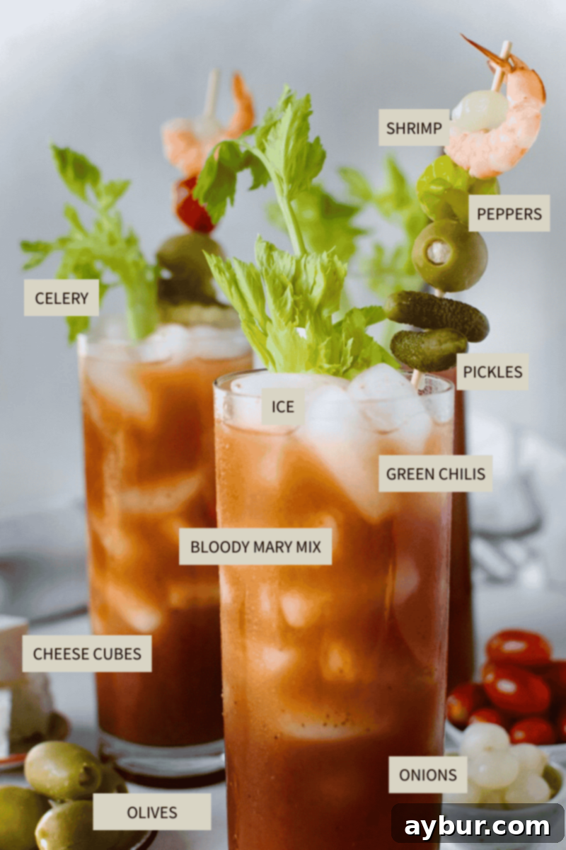 A comprehensive collection of ingredients laid out, featuring a bottle of Zing Zang Bloody Mary Mix, pickle juice, olive juice, banana pepper juice, black pepper, and a clear bottle of vodka, essential for the Perfect Bloody Mary Recipe.