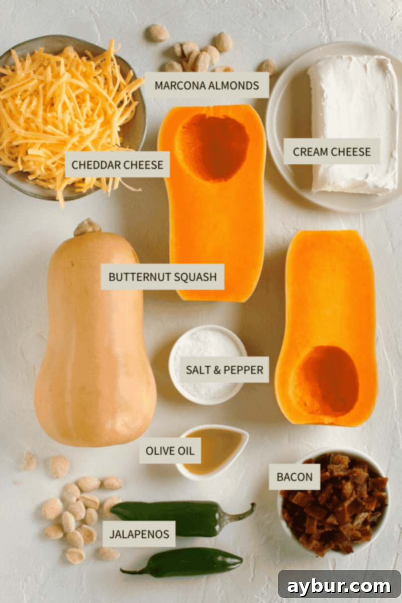 Jalapeño Popper Butternut Squash Boats 3 All ingredients laid out on a wooden board to make Stuffed Butternut Squash including squash, cream cheese, cheddar, bacon, and almonds.
