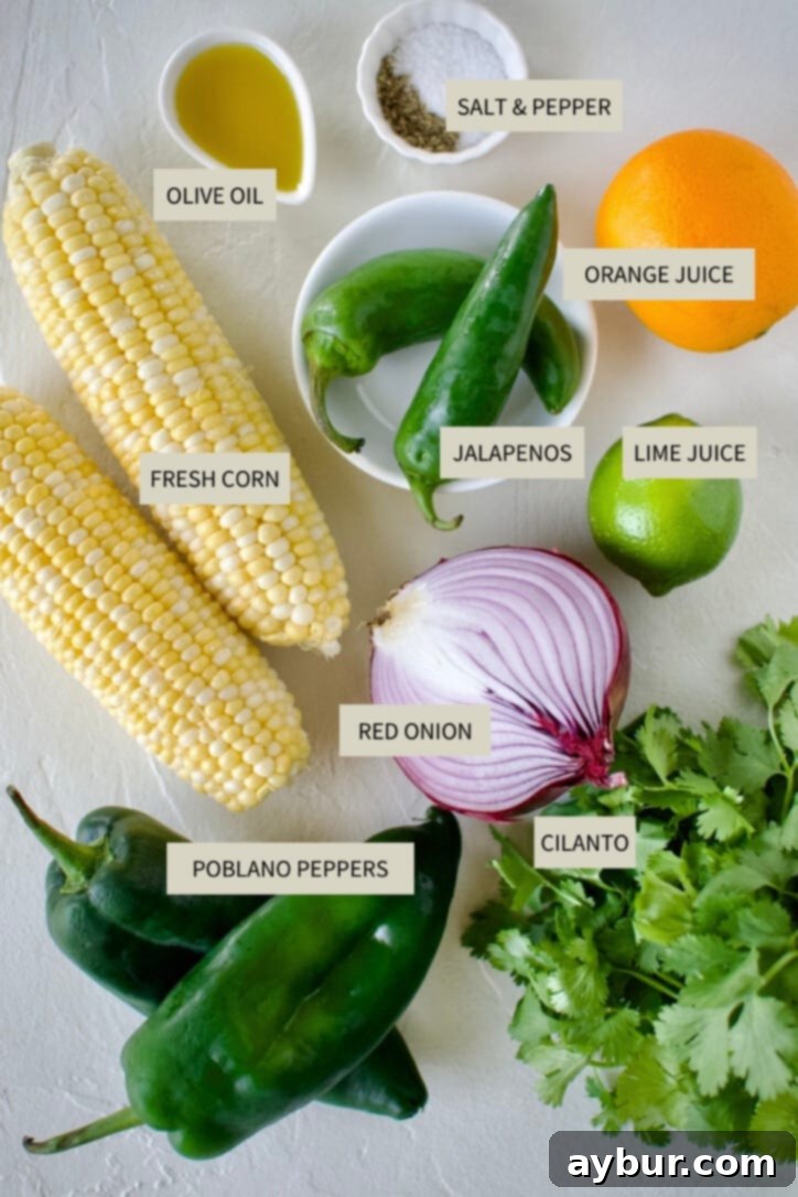 Smoky Sweet Corn and Pepper Salsa 3 A collection of fresh ingredients laid out on a wooden board, including ears of corn, poblano peppers, jalapenos, limes, an orange, red onion, and a bunch of cilantro, ready for making Roasted Chili-Corn Salsa.