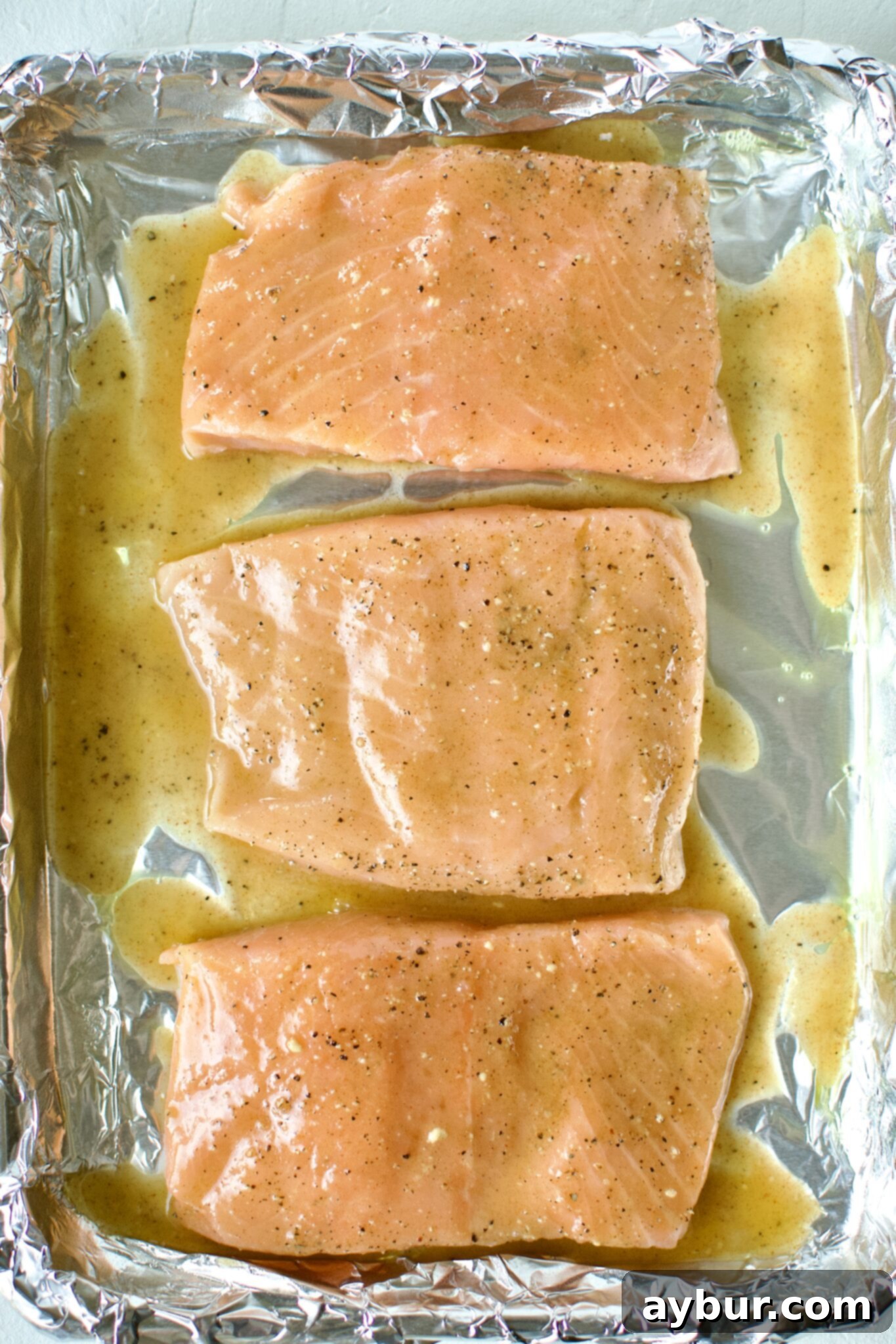 Crisp Pistachio Salmon 4 Salmon fillets with glaze on top.