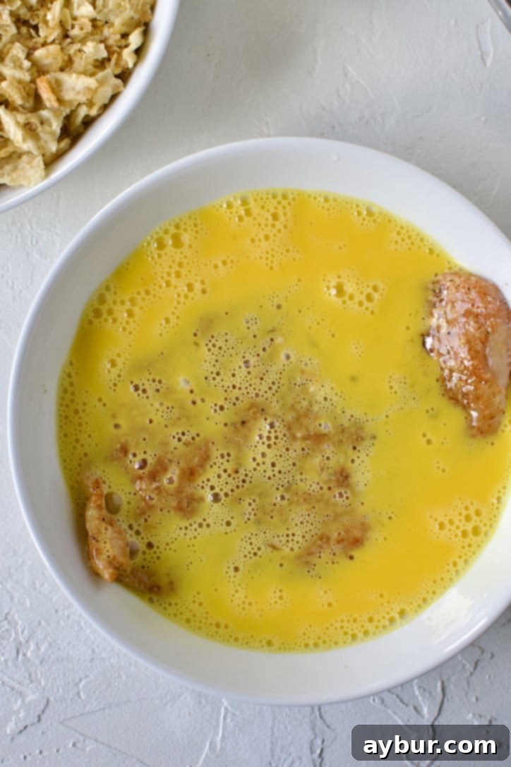 Chip-Crusted Chicken 6 battering the chicken in beaten eggs.