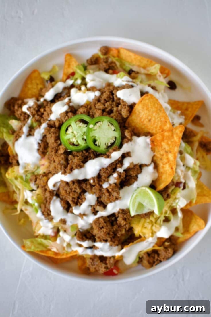 Taco Salad Recipe with Doritos on a large plate ready to eat.