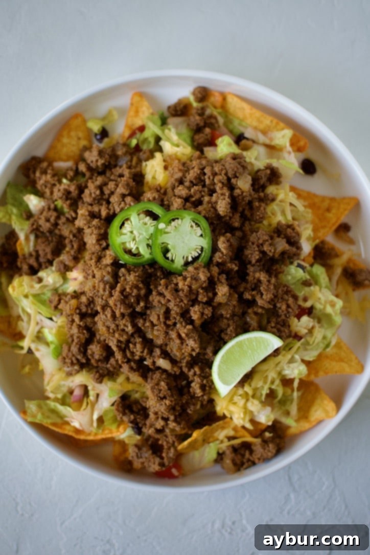 A final drizzle of creamy dressing over the completed taco salad.