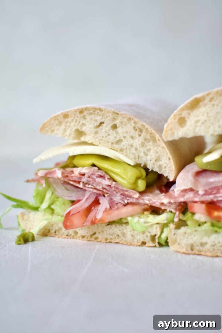 The fully assembled Italian Sub, perfectly sliced and ready to serve.