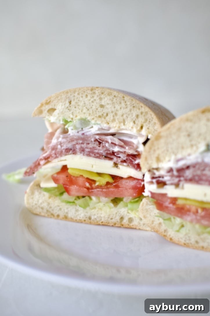 A delicious Italian Sub Sandwich, freshly sliced and ready to eat.