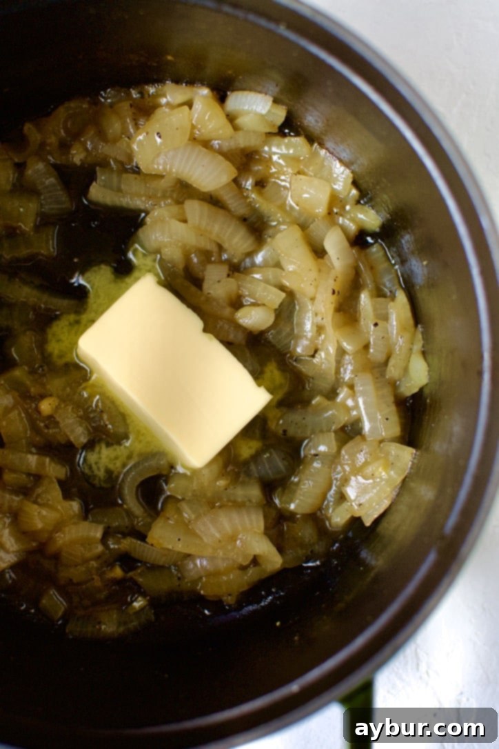 Onions after simmering out the liquid. Adding the butter to them.