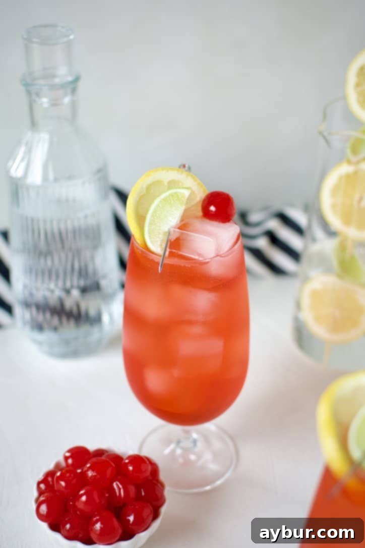 Shirley Temple Classic Mocktail 7 Dirty Shirley cocktail served in a tall glass with cherry garnish.