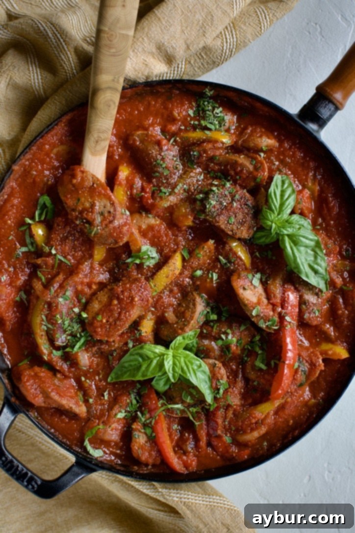 The ultimate skillet Italian Sausage and Peppers, perfectly cooked and ready to serve, featuring savory sausage, colorful peppers, and a rich tomato sauce.