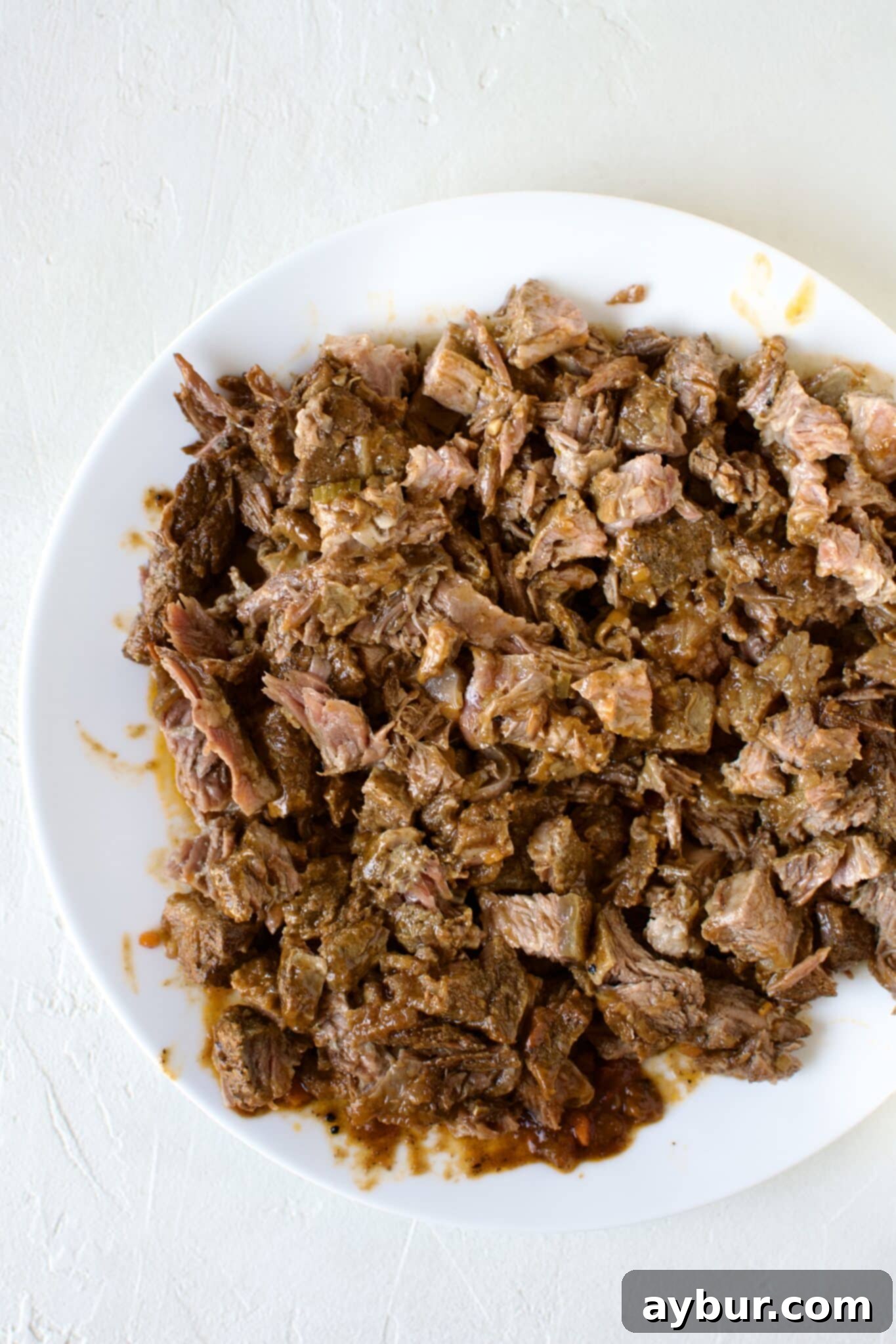 Tender short rib meat, now diced into small, ready-to-serve pieces.