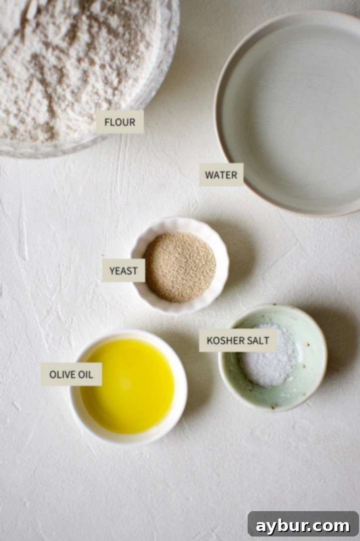 A selection of essential ingredients for thin-crust pizza dough: all-purpose flour, warm water, active dry yeast, kosher salt, and olive oil.