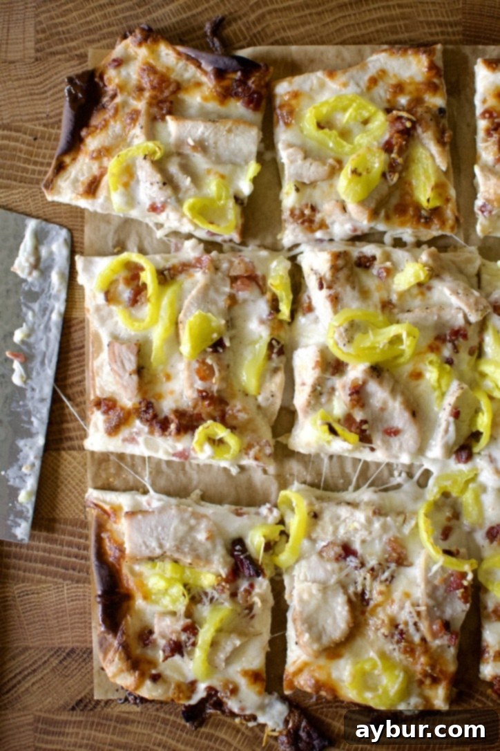 Creamy Garlic White Pizza 13 White Pizza Recipe fresh out of the oven and cut into pieces.