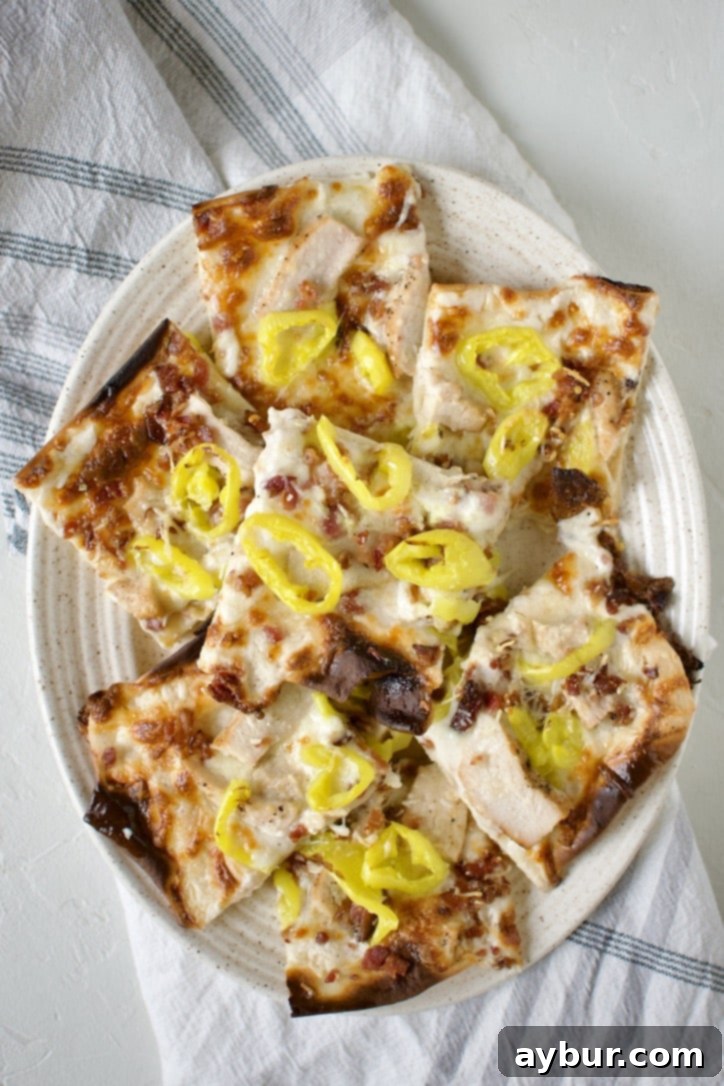 Creamy Garlic White Pizza 15 Beautifully arranged platter of freshly baked white pizza slices, ready to be served and enjoyed.