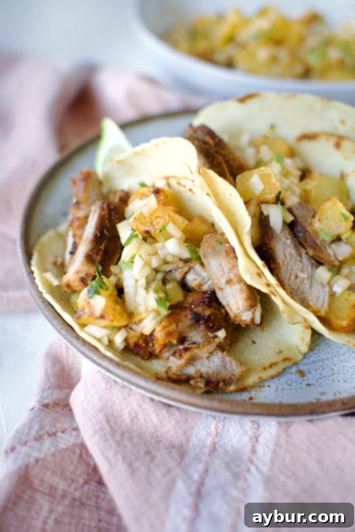 Authentic Al Pastor Tacos 11 Al Pastor Taco Recipe in homemade corn tortillas topped with pineapple salsa.