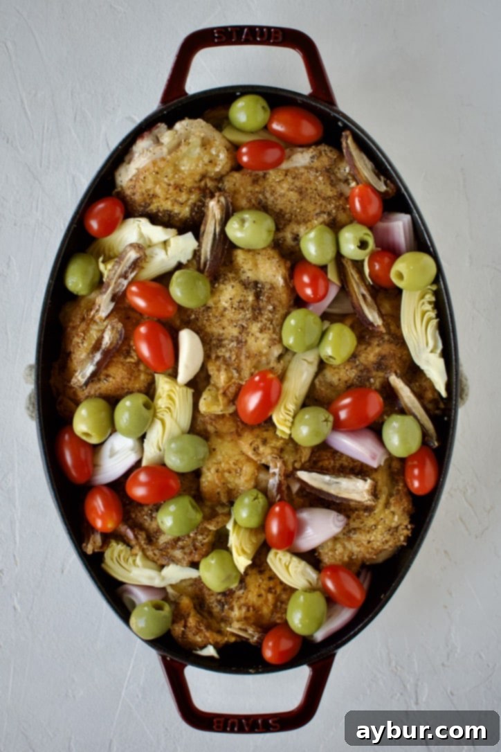 Mediterranean Herb Roasted Chicken 5 Before cooking: all ingredients are arranged in the pan for Chicken Provencal, prior to simmering.