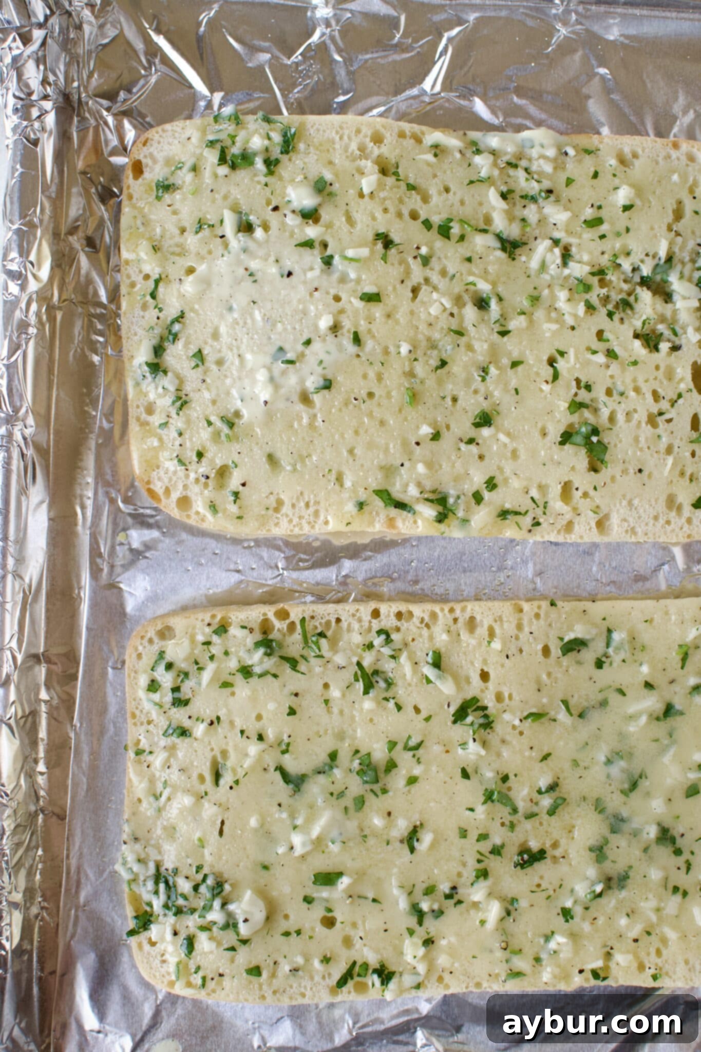 The ciabatta bread before toasting, with its cut side exposed.