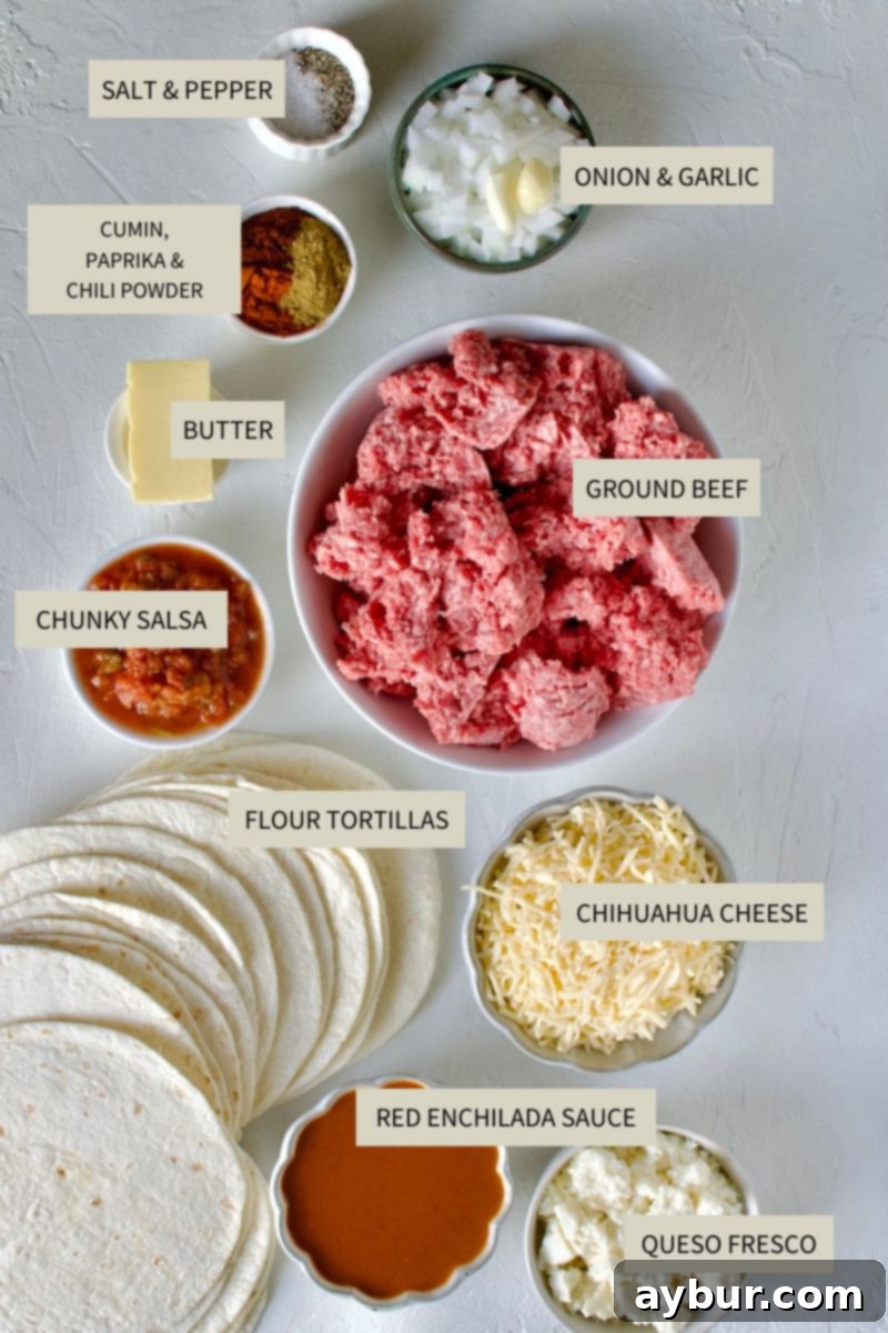 A selection of fresh ingredients including ground beef, onions, garlic, spices, cheese, and tortillas, laid out for making Ground Beef Enchiladas.