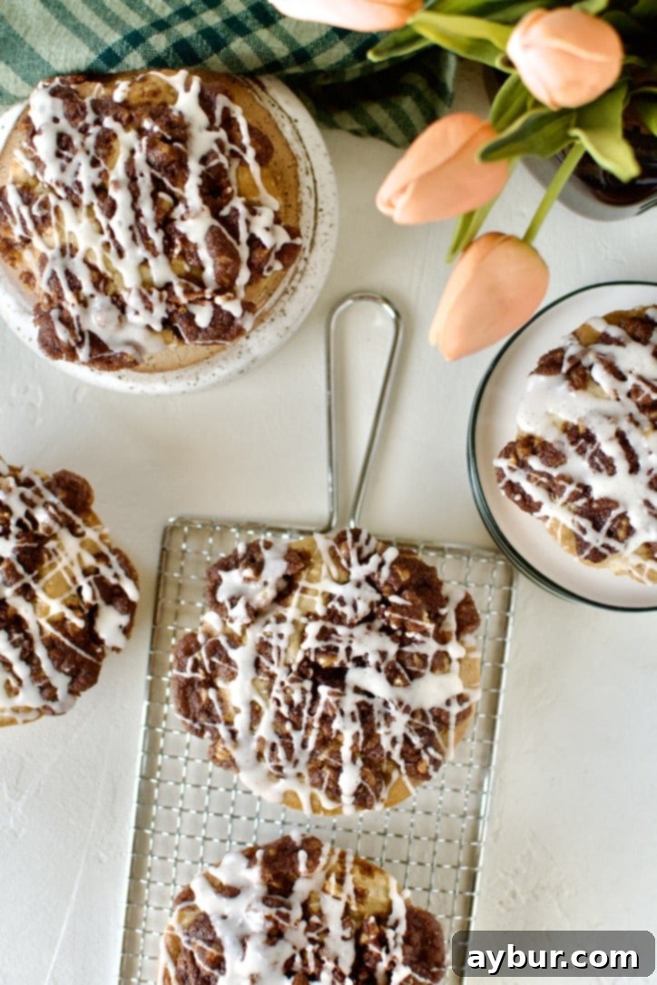 Golden Apple Crumb Muffins 13 Glazed Apple Streusel Muffins on a table displayed and ready to eat.