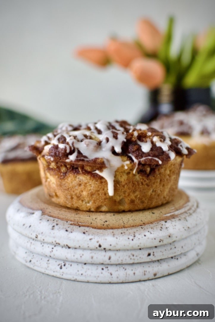 Golden Apple Crumb Muffins 15 Glazed Apple Streusel Muffins on a table displayed and ready to eat.