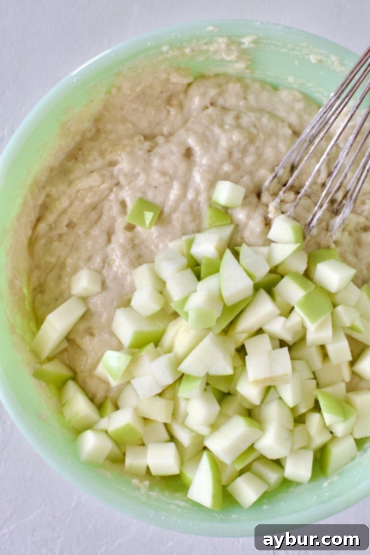 Golden Apple Crumb Muffins 6 Mixing up the muffin batter and folding in the chopped apple.