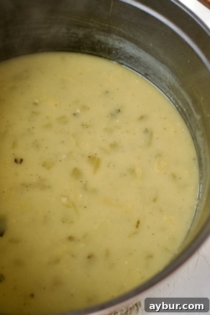 Velvety Sour Cream Enchilada Sauce 4 Thickening the butter and flour mixture (roux) in a large pot for the sauce base.