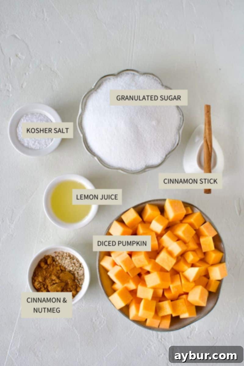 A collection of ingredients laid out on a surface, including fresh pumpkin, sugar, lemon, and spices, all ready to be used for making Pumpkin Jam.