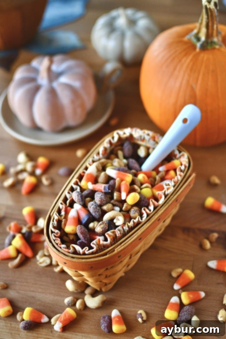 A small bowl of the finished candy corn and peanuts mix, ready for snacking.