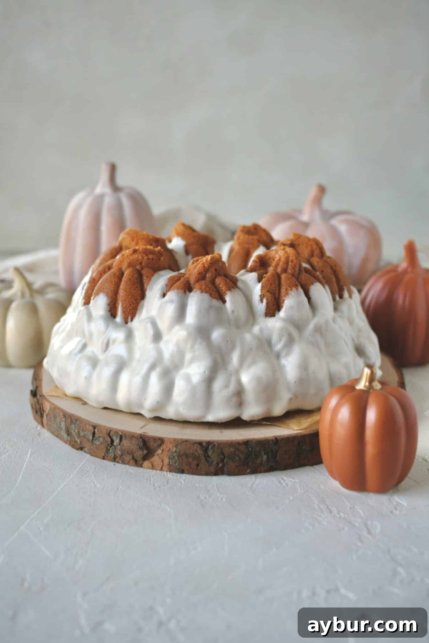 Pumpkin Spice Swirl Pound Cake 14 Pumpkin Pound Cake baked and removed from the bundt pan that looks like pumpkins in a field.