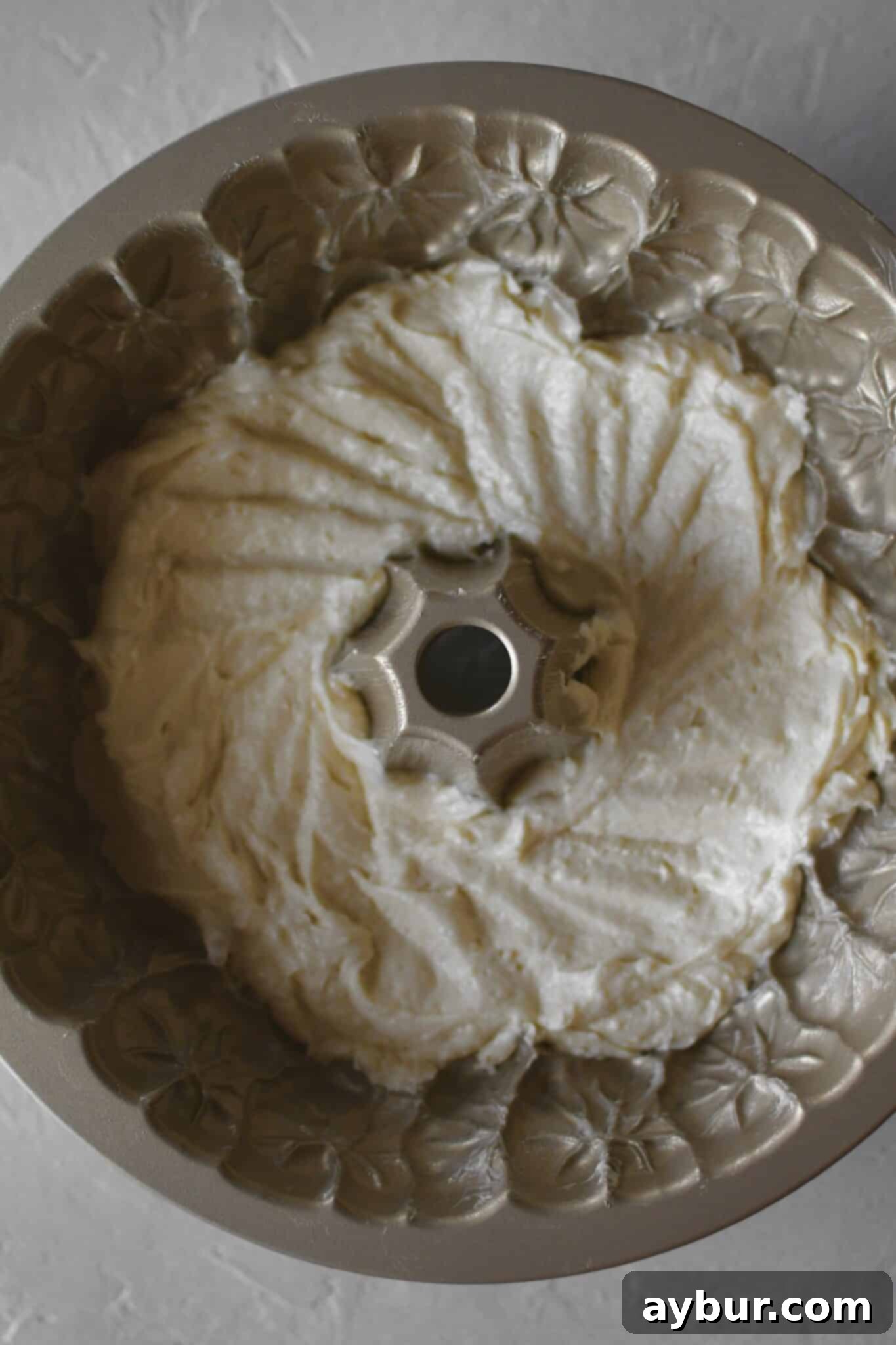 Pumpkin Spice Swirl Pound Cake 9 Layering the cake in the bundt pan, starting with the plain cake.