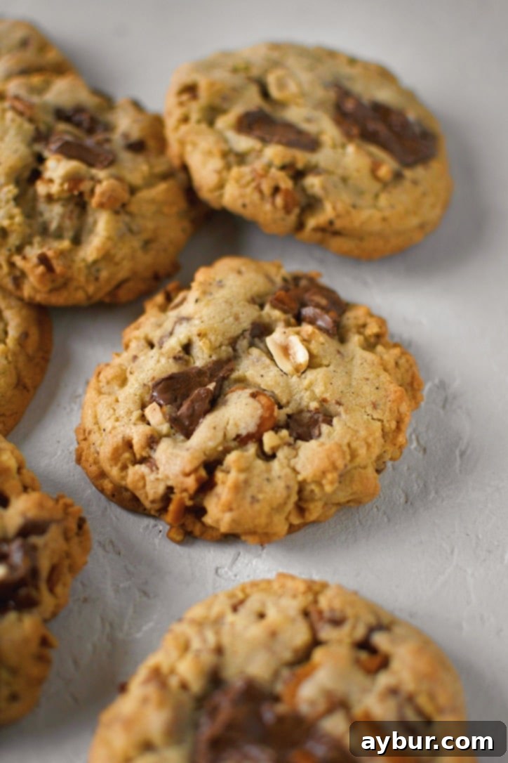 Baked Kitchen Sink Cookies cooling on a wire rack on a table.