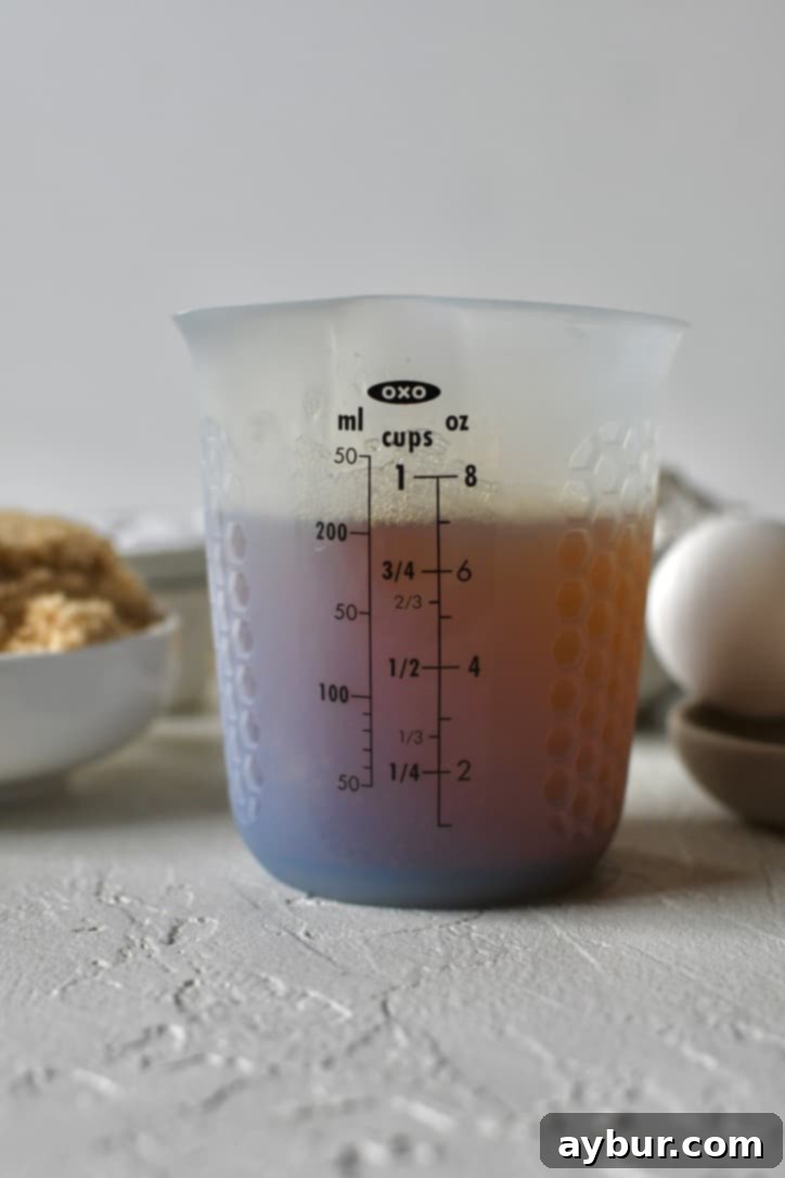 Two sticks of butter after being browned to a rich, golden color in a saucepan.