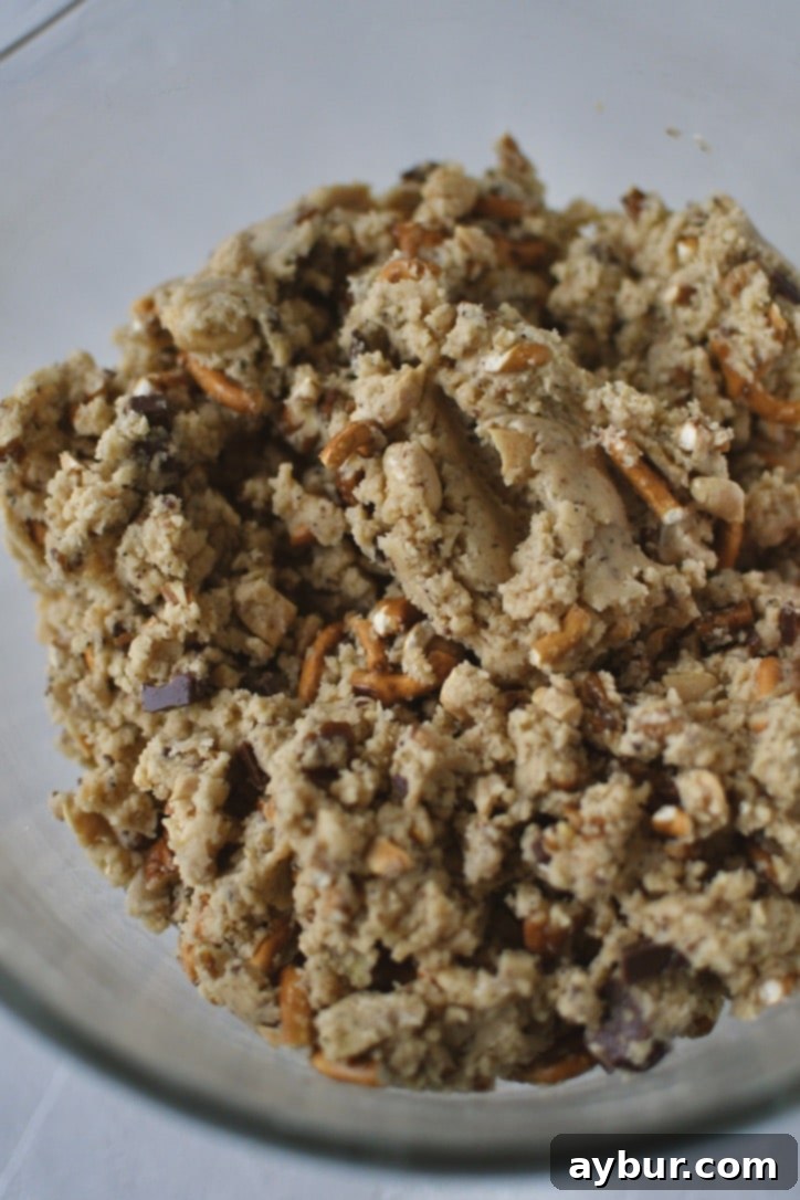 Cookie dough generously studded with nuts, chocolate chunks, and pretzels.