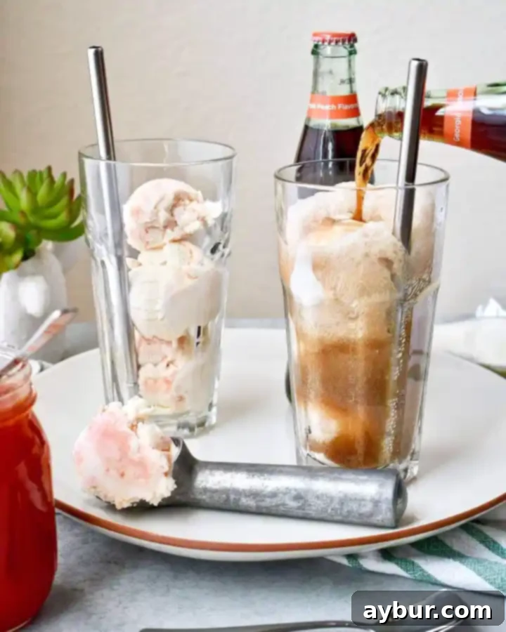 Creamy Fizz Delight 3 Close-up of a glass of Peach Jam Ice Cream Soda with a spoon