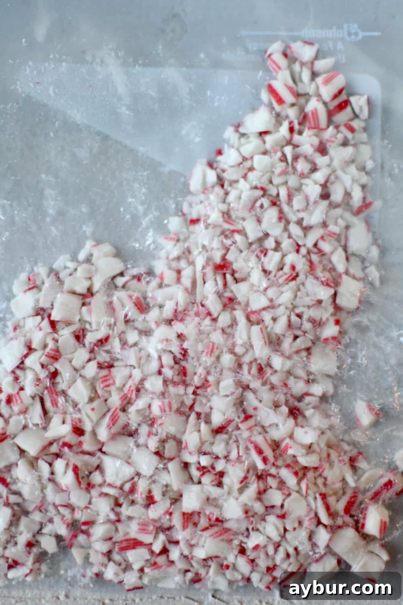 Peppermint Chocolate Delights 11 Crushed candy cane pieces in a zip-top bag, ready for topping cookies.