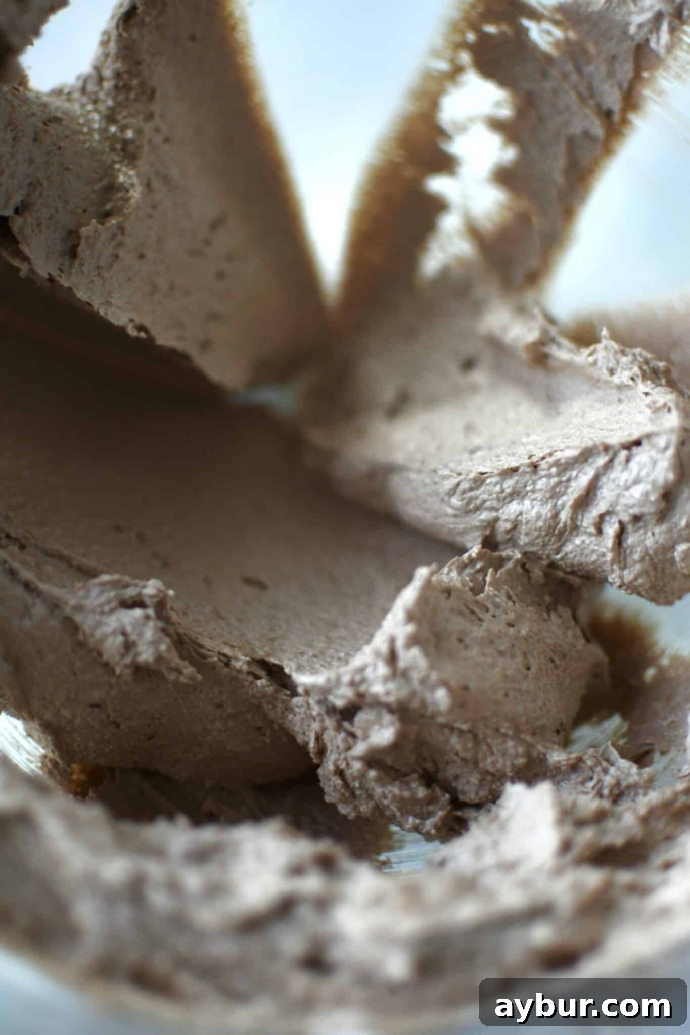 Peppermint Chocolate Delights 6 Dry ingredients, including flour and cocoa, being added to the creamed butter and chocolate mixture.