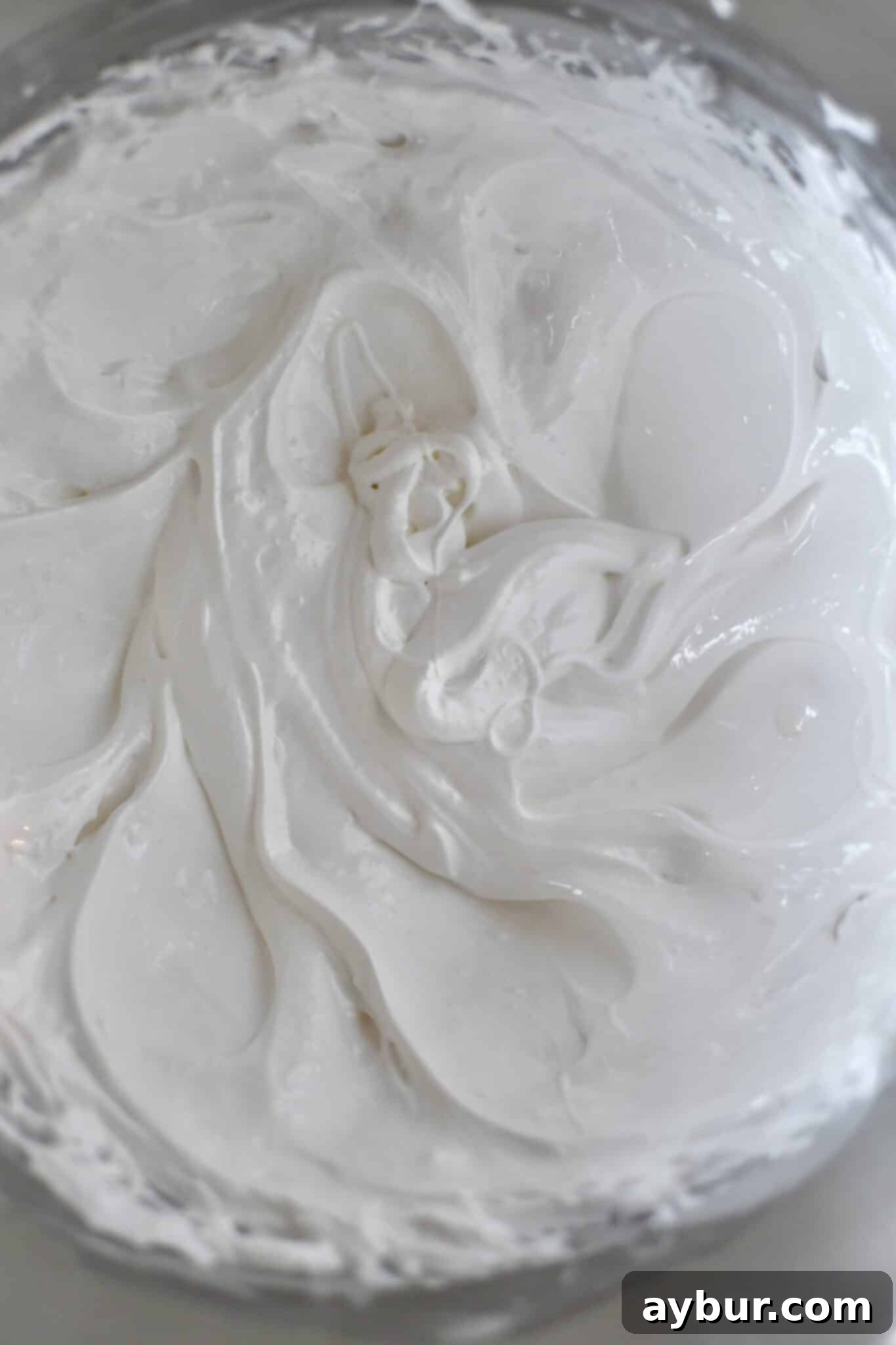 Peppermint Chocolate Delights 9 Whipped egg whites and sugar forming a fluffy, glossy meringue.