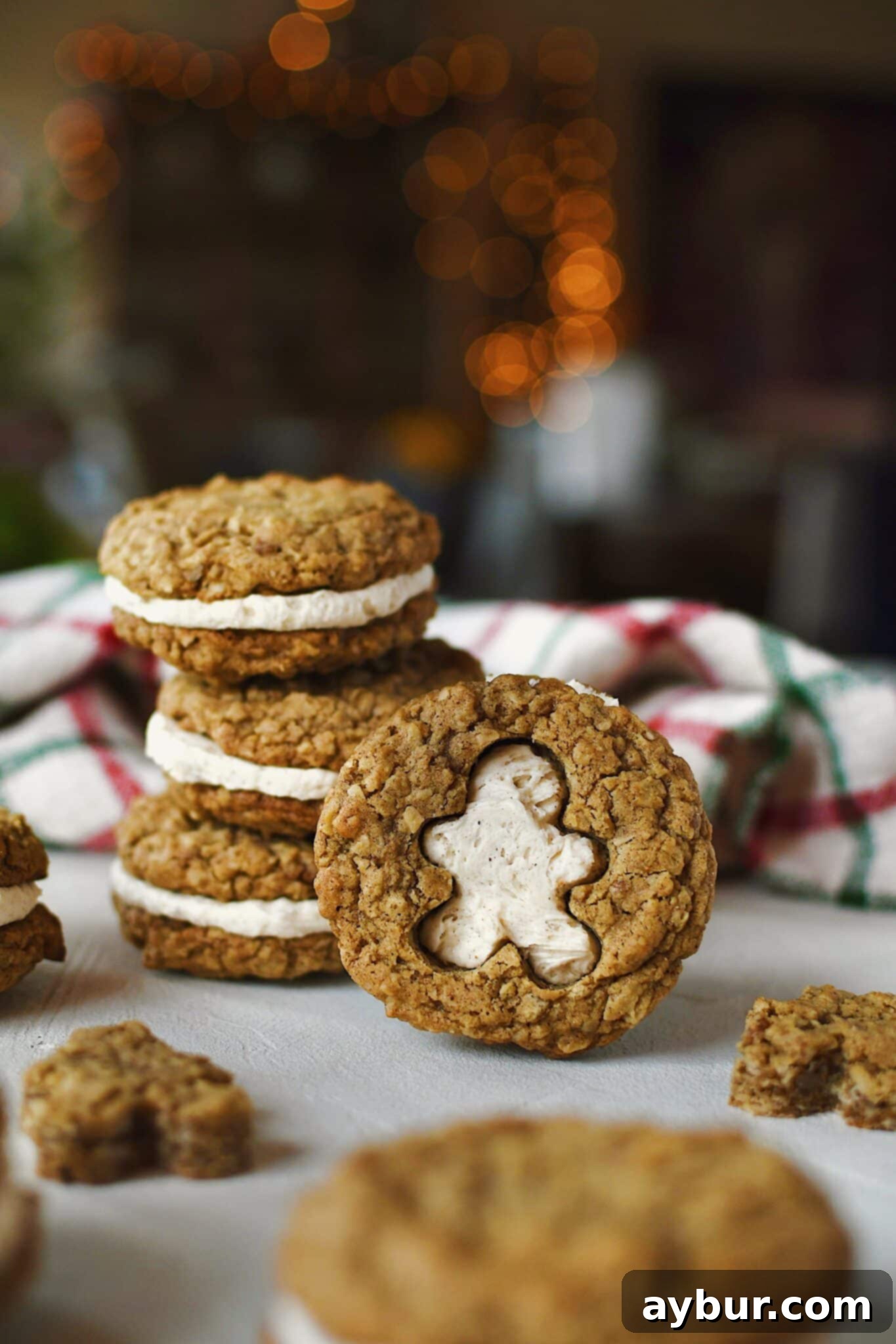 Gingerbread Oatmeal Whoopie Pies 19 A stunning shot of a Gingerbread Oatmeal Cream Pie, with a charming gingerbread man shape cut out and cream filling peeking through, against a festive background.