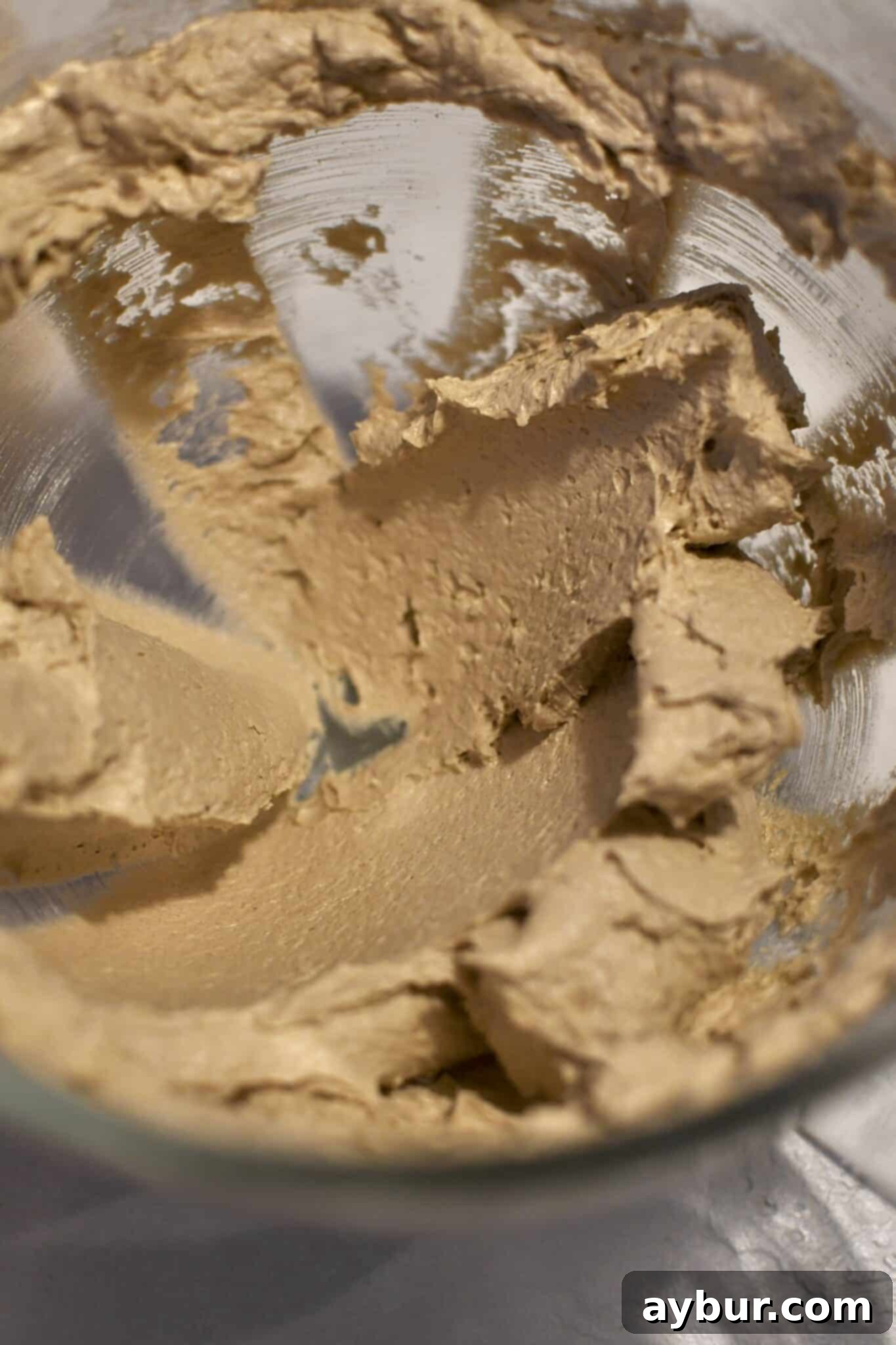 Gingerbread Oatmeal Whoopie Pies 5 Creamed butter and sugars, with egg, vanilla extract, and molasses incorporated, forming a smooth, golden mixture.