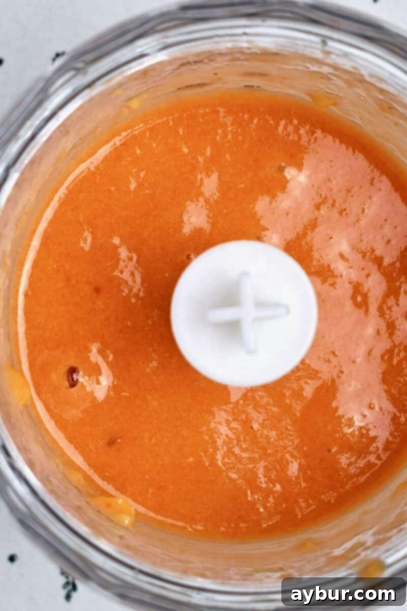 Delicious Homemade Peach Jam 9 Peaches that have been blanched and peeled after pureeing in a mini food processor.