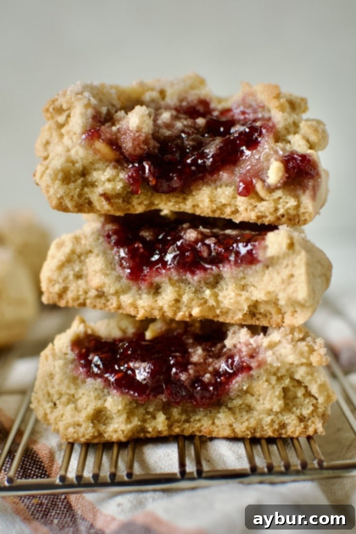 Peanut Butter Jelly Dream Cookies 2 Freshly baked Peanut Butter and Jelly Cookies on a wire rack.