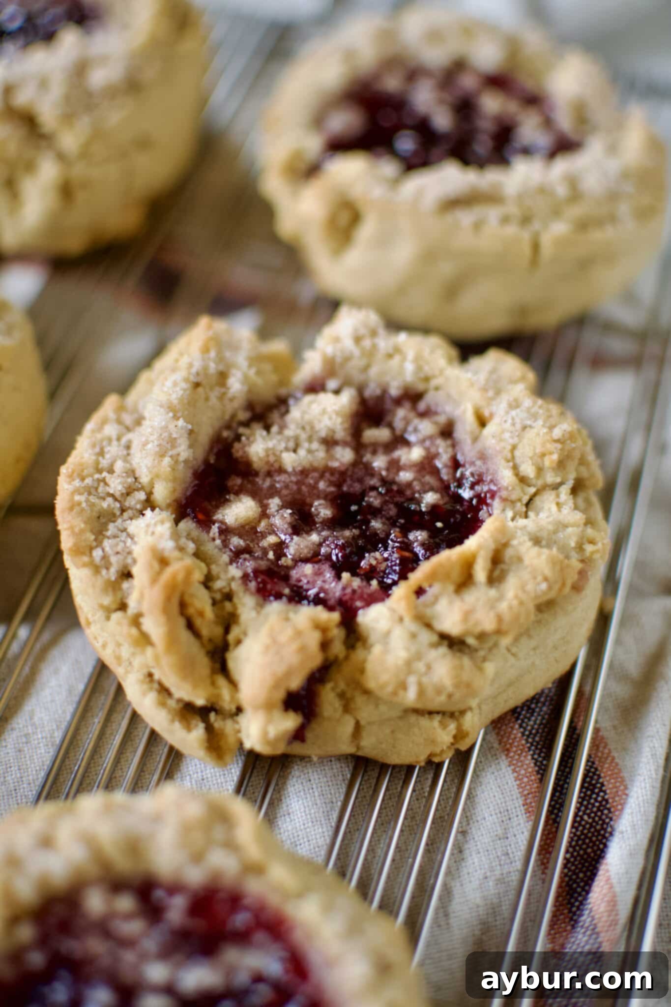 Peanut Butter Jelly Dream Cookies 13 Peanut Butter and Jelly Cookies on a cooling rack.