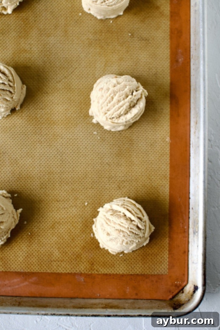 Peanut Butter Jelly Dream Cookies 7 Portioned cookies on a sheet pan.