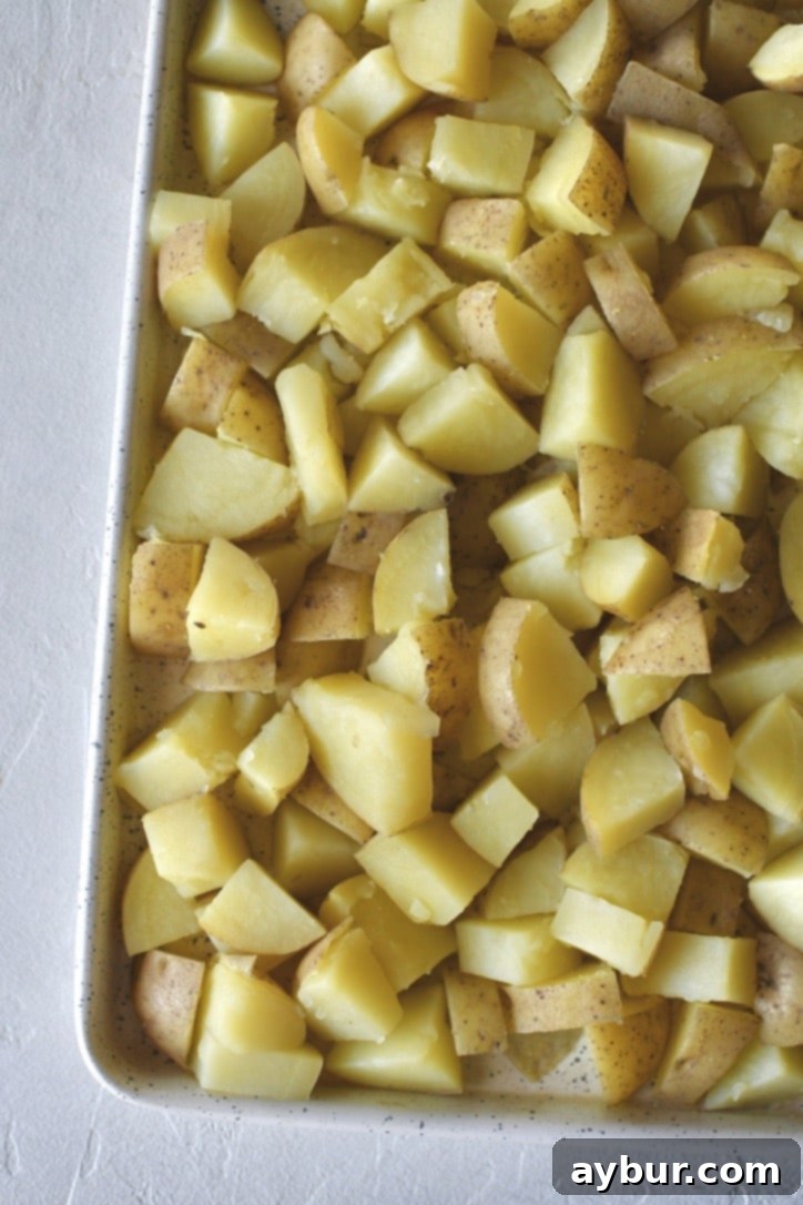 Boiled potatoes cooling a bit before adding the sauce.